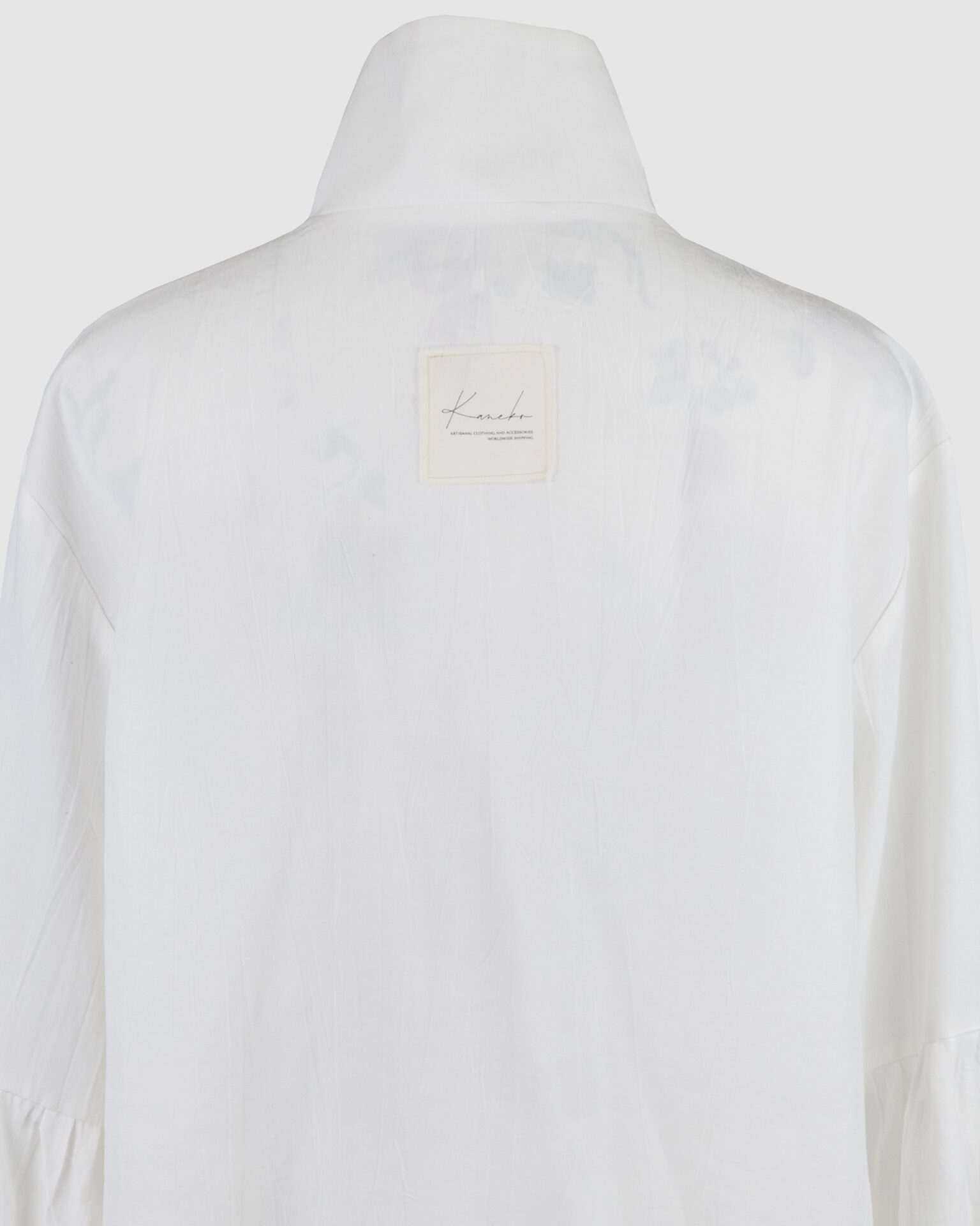 Shirt with asymmetrical fastening