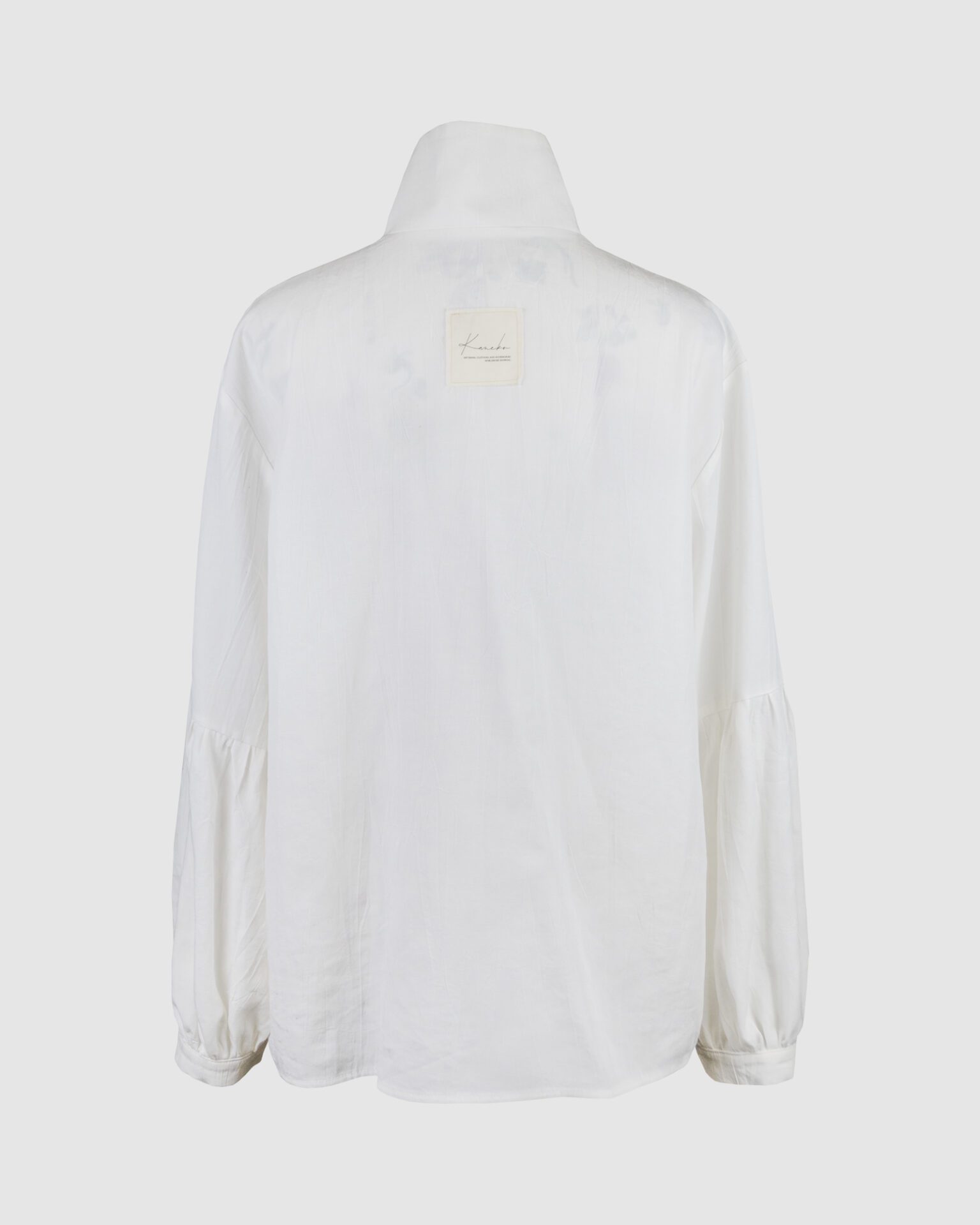 Shirt with asymmetrical fastening