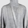 Relaxed fit shirt with stand collar, press stud asymmetrical fastening and double gathered bishop sleeves.