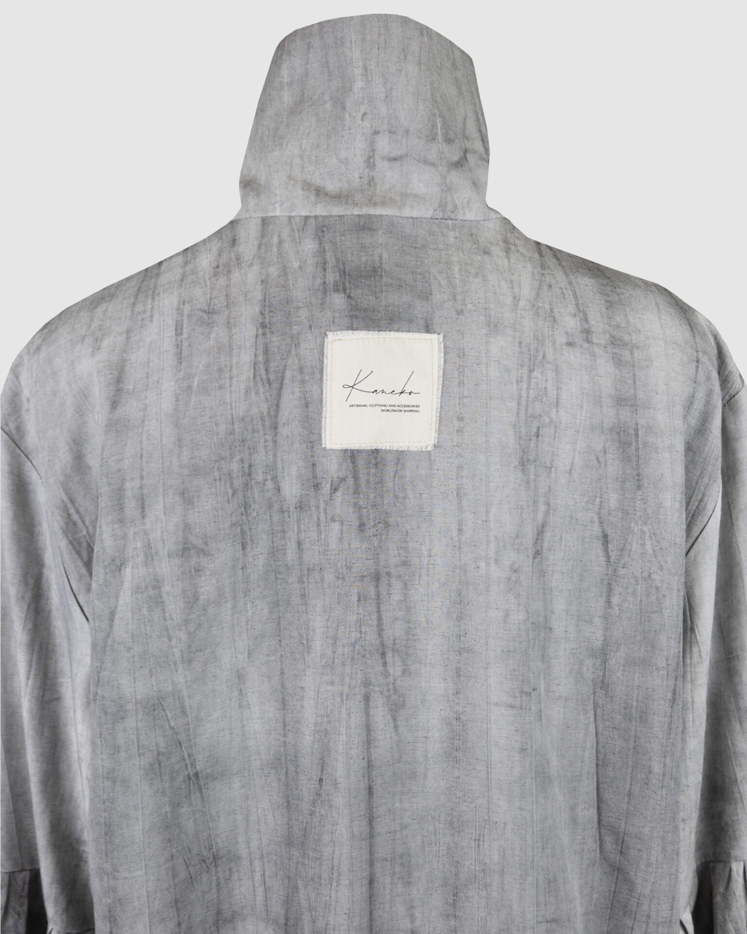 Relaxed fit shirt with stand collar, press stud asymmetrical fastening and double gathered bishop sleeves.