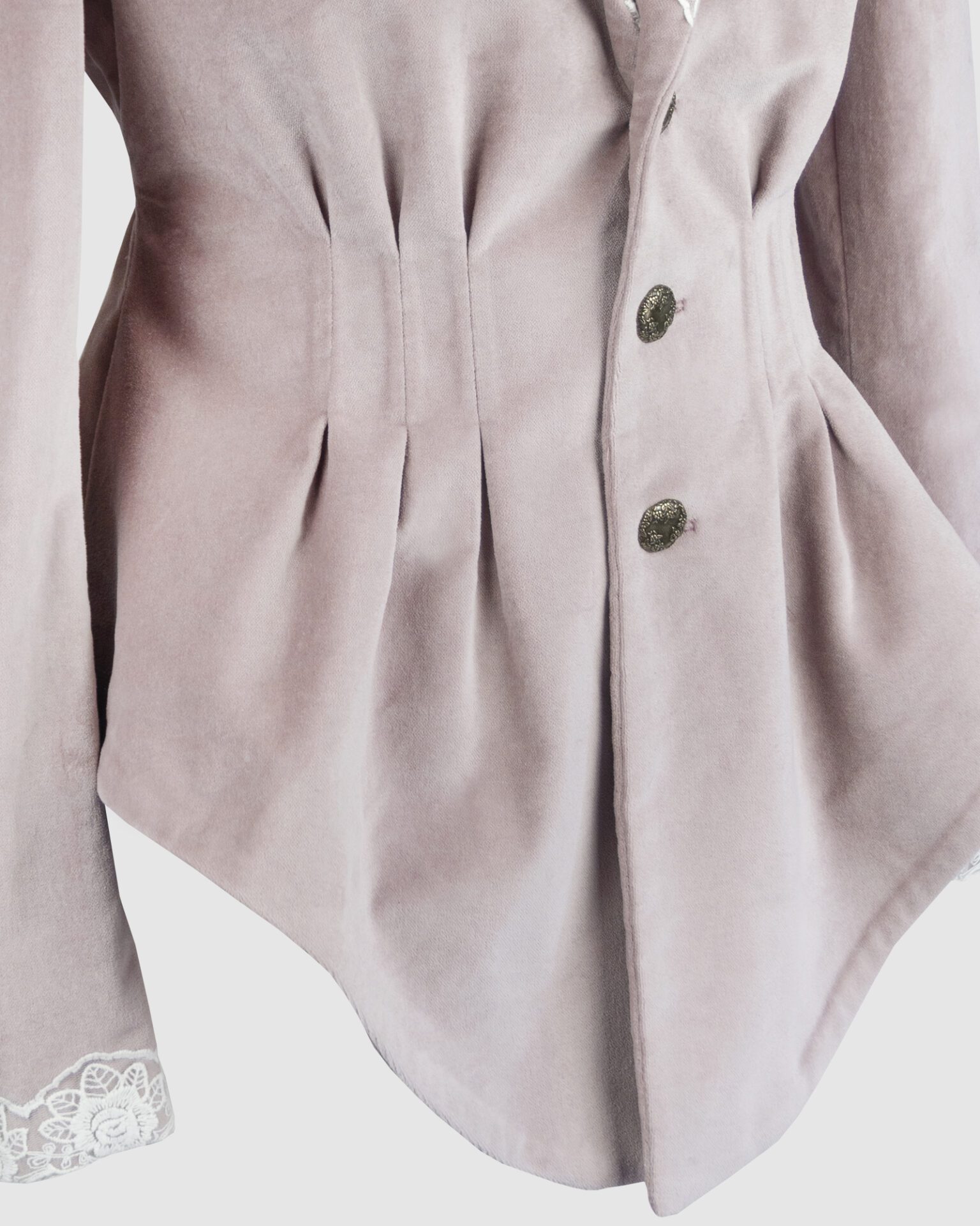 Fitted, single breasted cotton velvet jacket with a narrow peak lapel collar, released tucks at the waist, side seam pockets, and a softly pointed front hem.