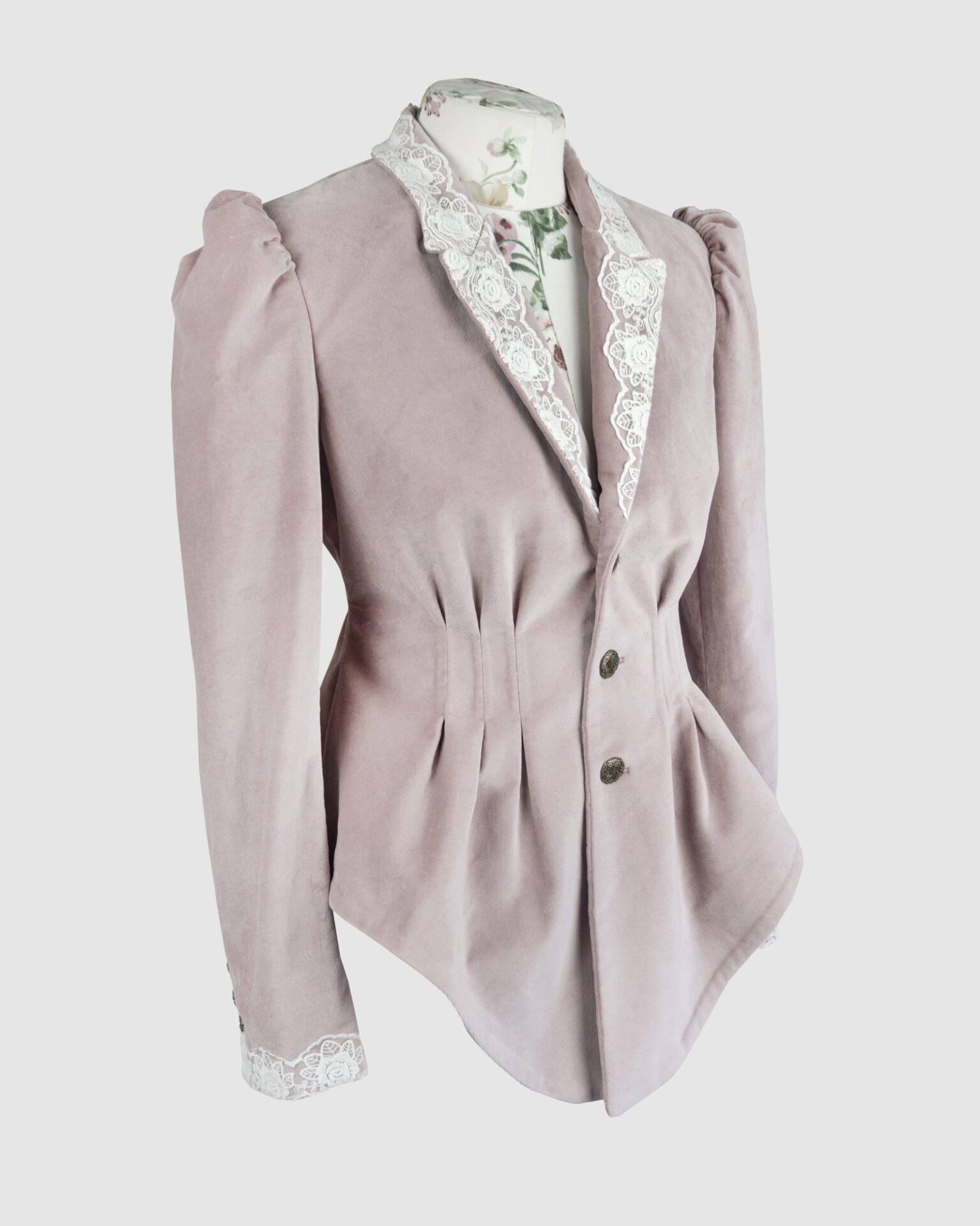 Fitted, single breasted cotton velvet jacket with a narrow peak lapel collar, released tucks at the waist, side seam pockets, and a softly pointed front hem.