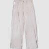 Trousers with overlapping pleats