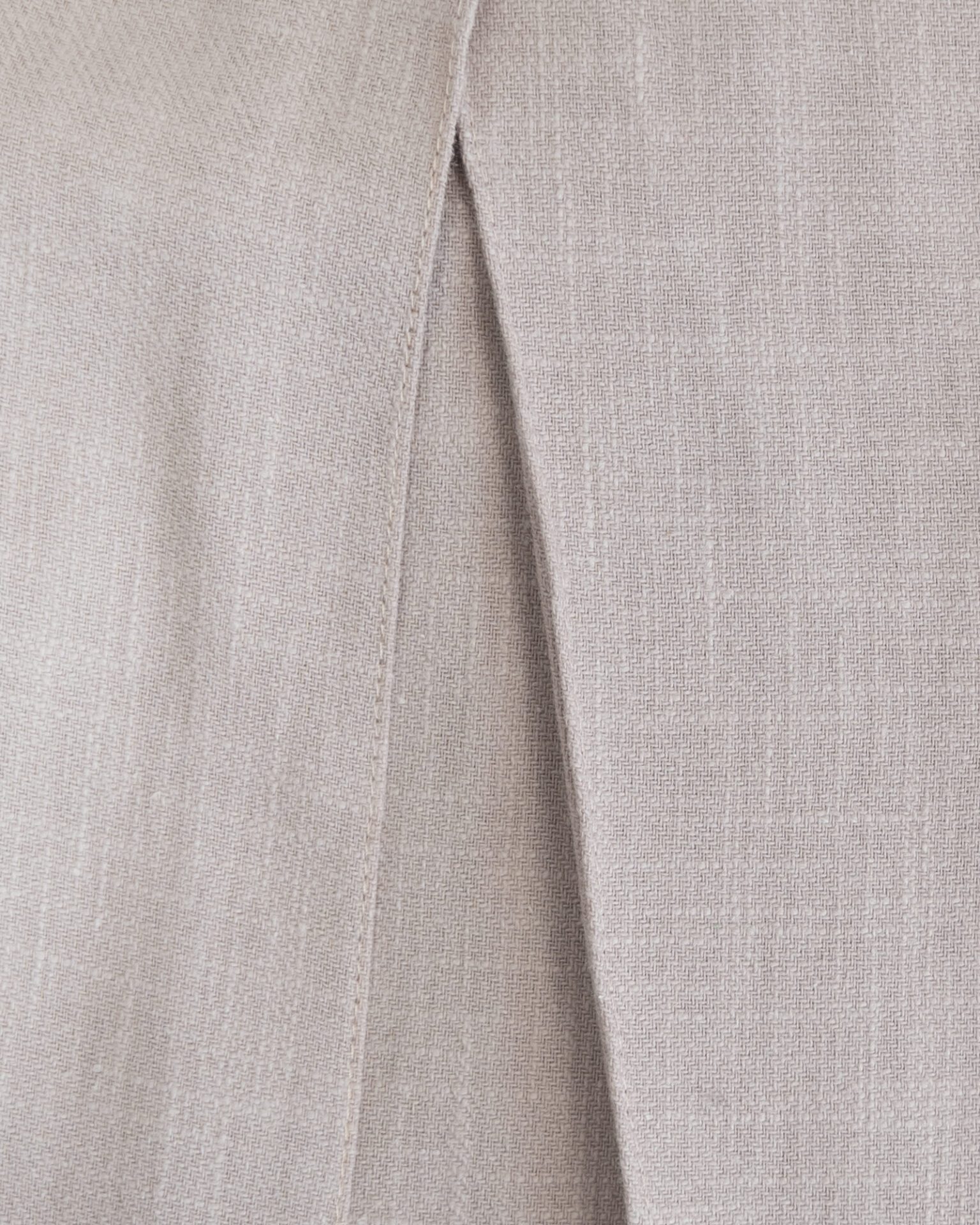 Trousers with overlapping pleats