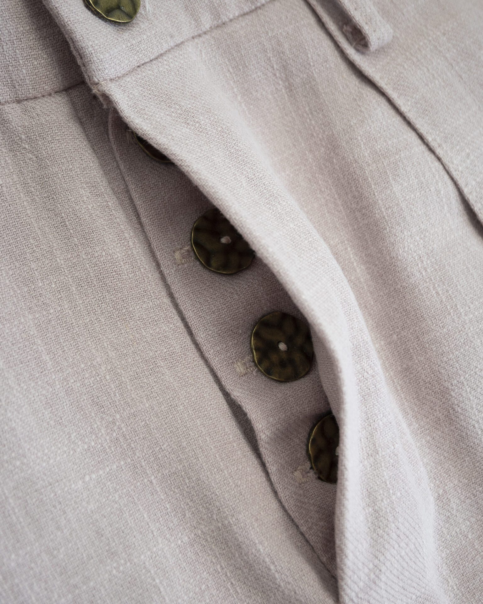 Trousers with overlapping pleats