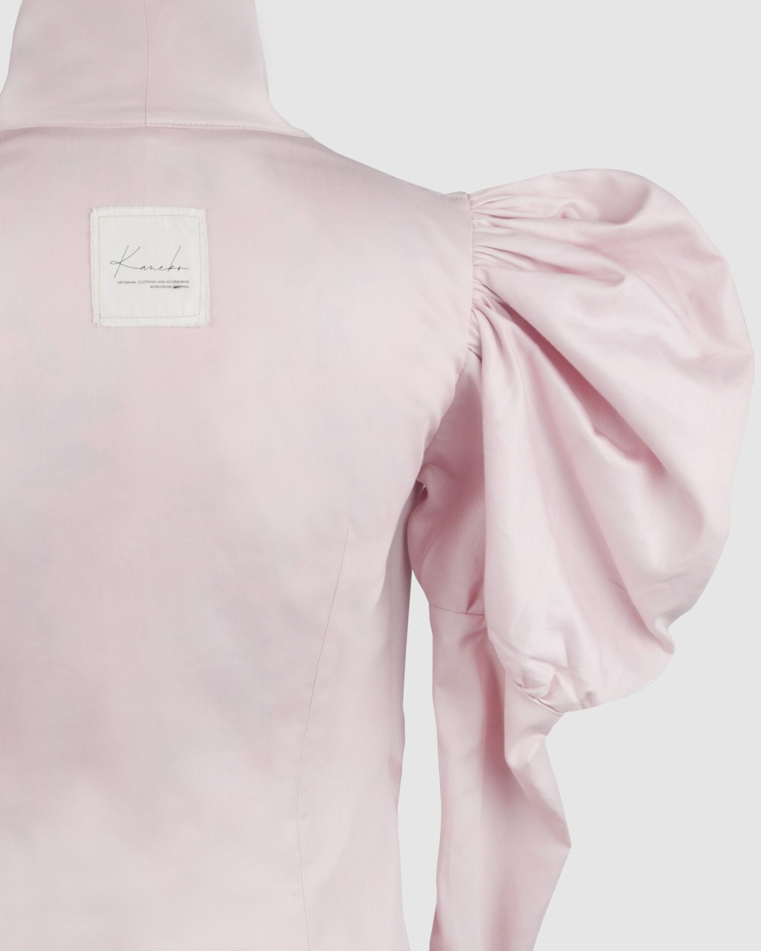 Cotton satin fitted blouse with a draped front and voluminous sleeves.