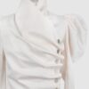 Cotton satin fitted blouse with a draped front and voluminous sleeves.