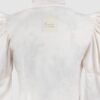 Cotton satin fitted blouse with a draped front and voluminous sleeves.