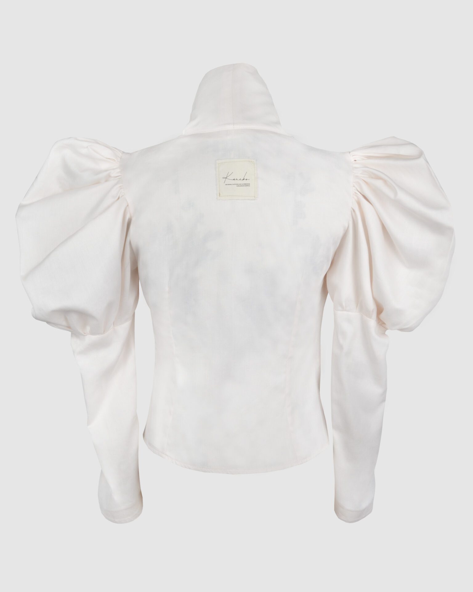 Cotton satin fitted blouse with a draped front and voluminous sleeves.
