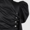 Cotton satin fitted blouse with a draped front and voluminous sleeves.