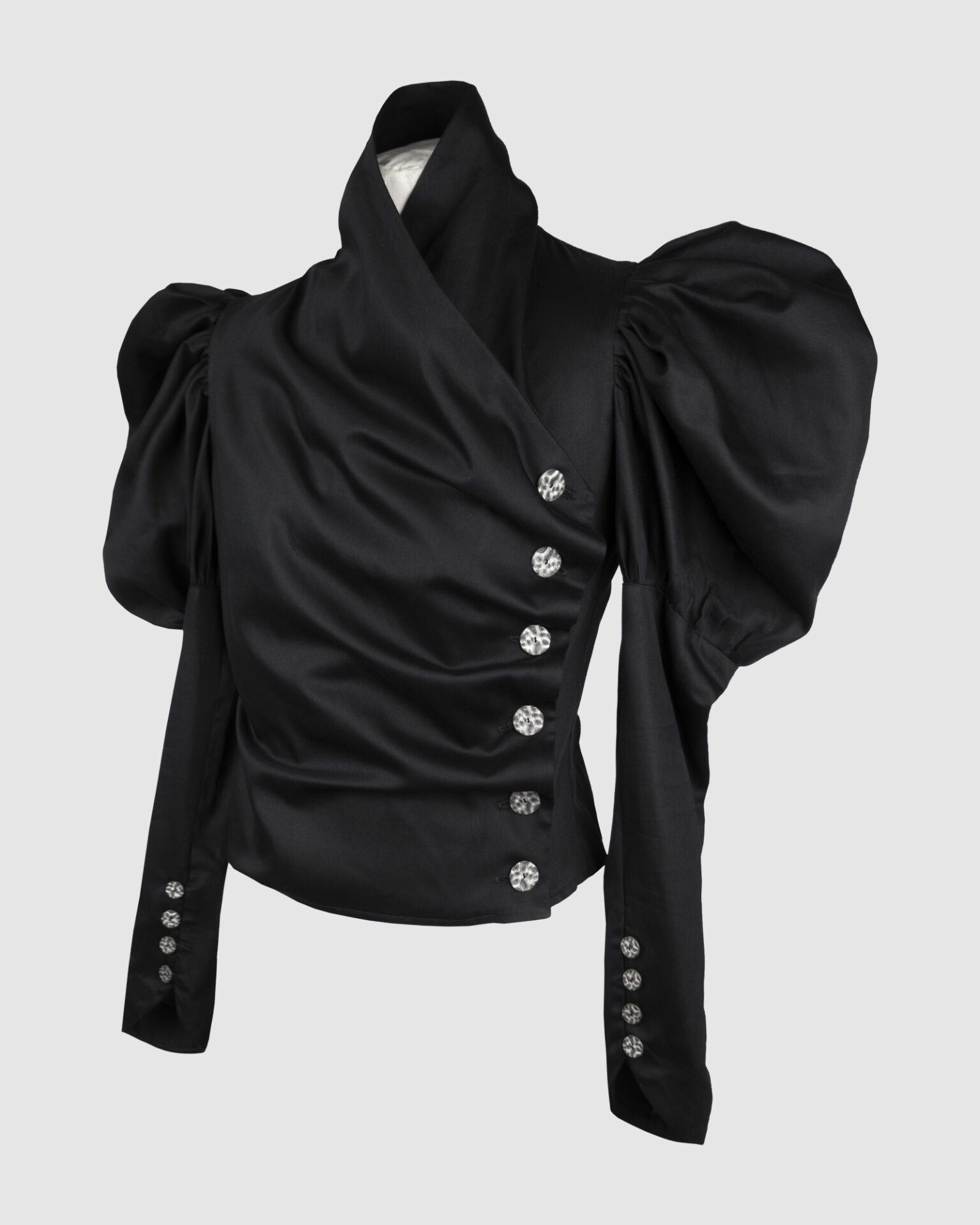 Cotton satin fitted blouse with a draped front and voluminous sleeves.