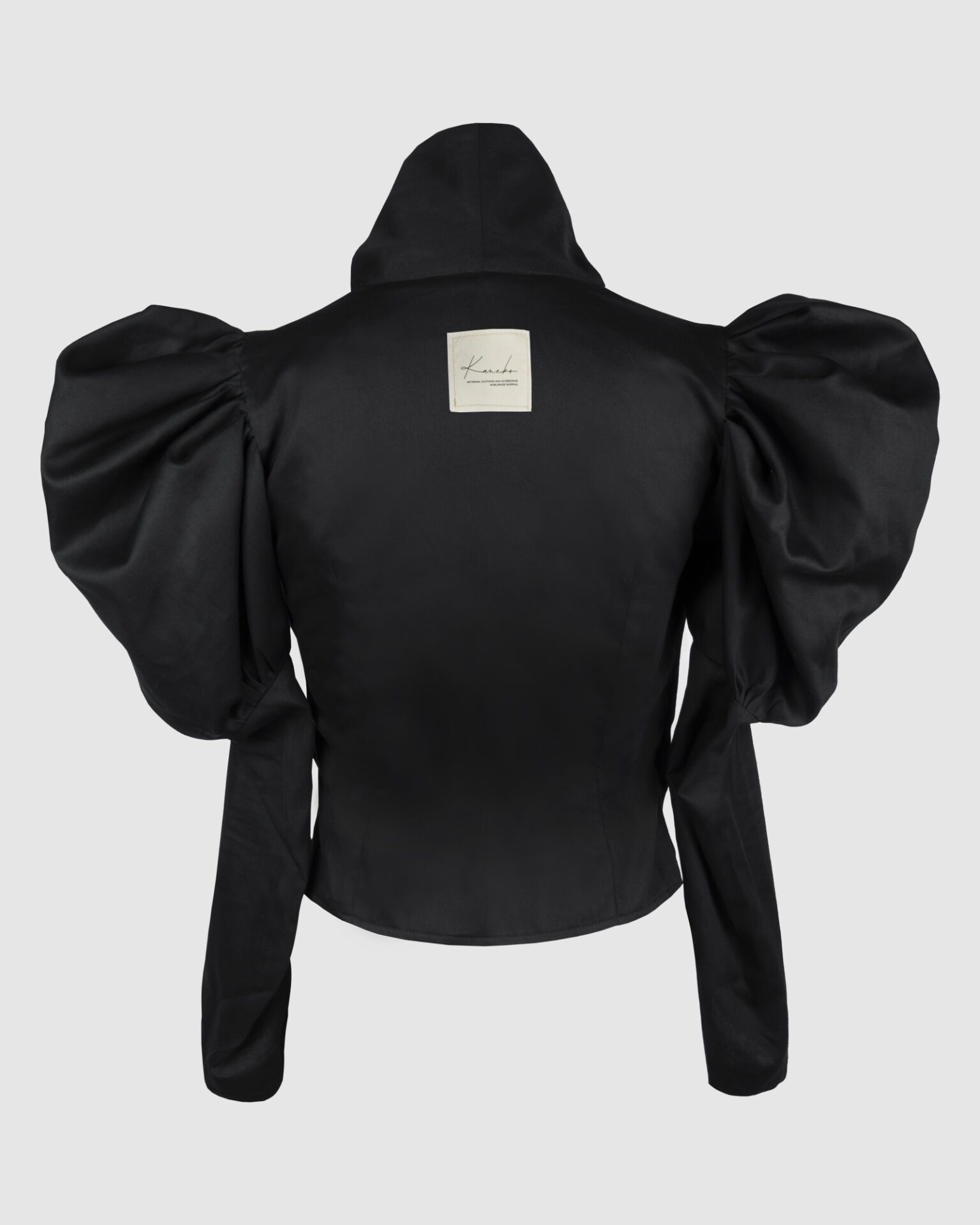 Cotton satin fitted blouse with a draped front and voluminous sleeves.