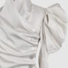 Cotton satin fitted blouse with a draped front and voluminous sleeves.