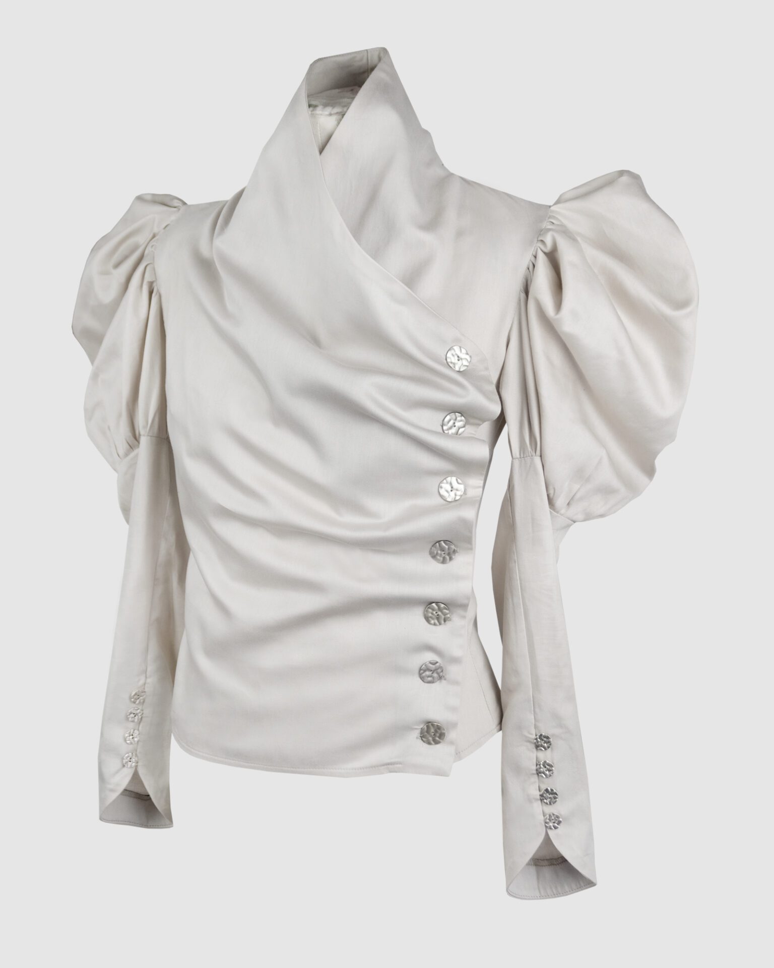 Cotton satin fitted blouse with a draped front and voluminous sleeves.