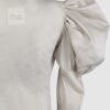 Cotton satin fitted blouse with a draped front and voluminous sleeves.