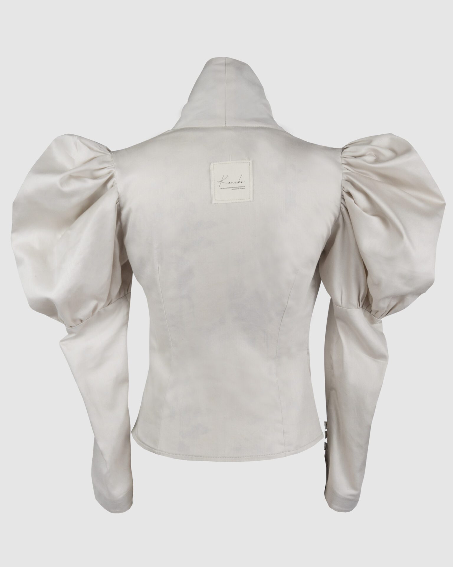 Cotton satin fitted blouse with a draped front and voluminous sleeves.