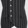 The long, fitted vest features a stand collar, a welt breast pocket, and pockets with pointed flaps.