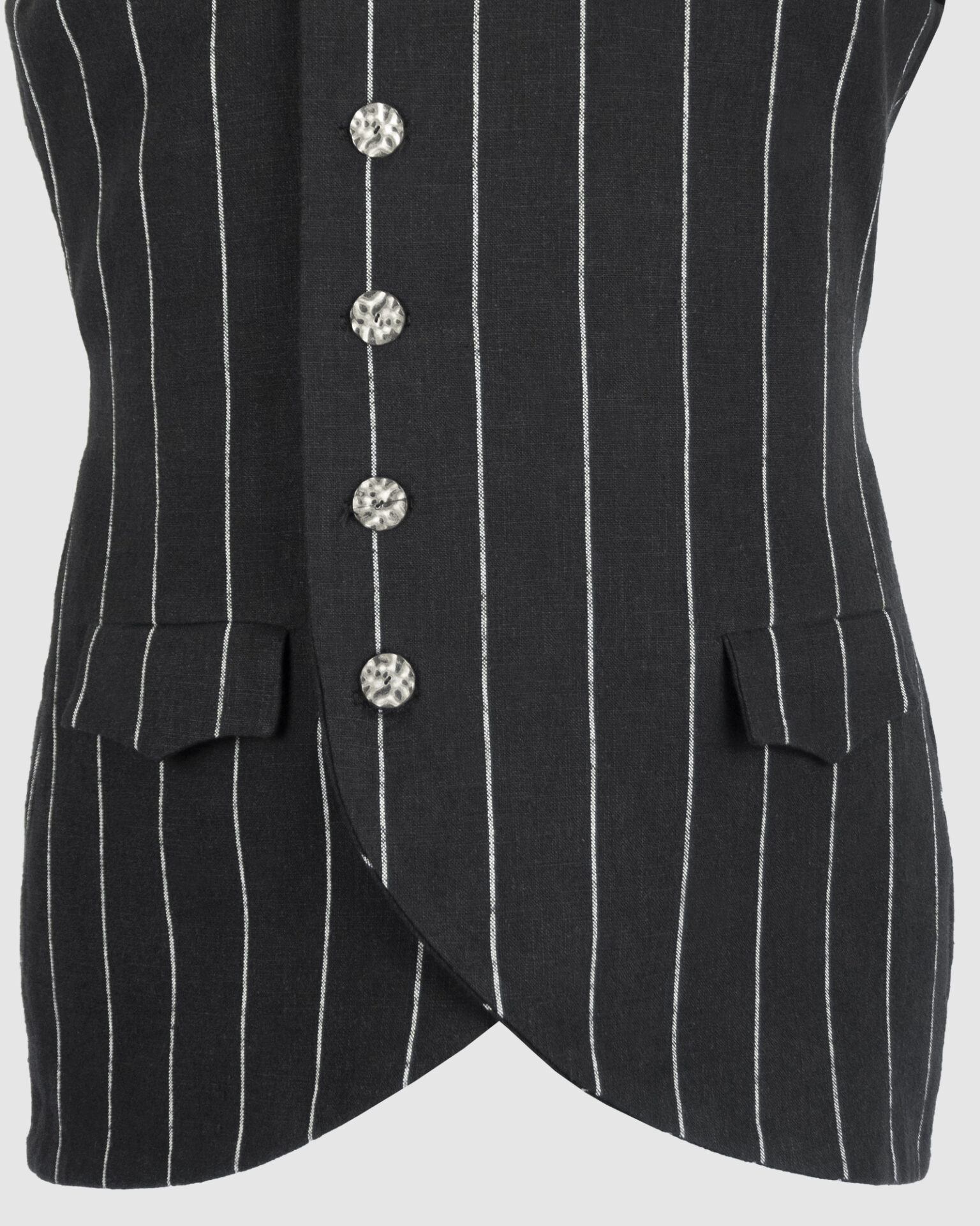 The long, fitted vest features a stand collar, a welt breast pocket, and pockets with pointed flaps.