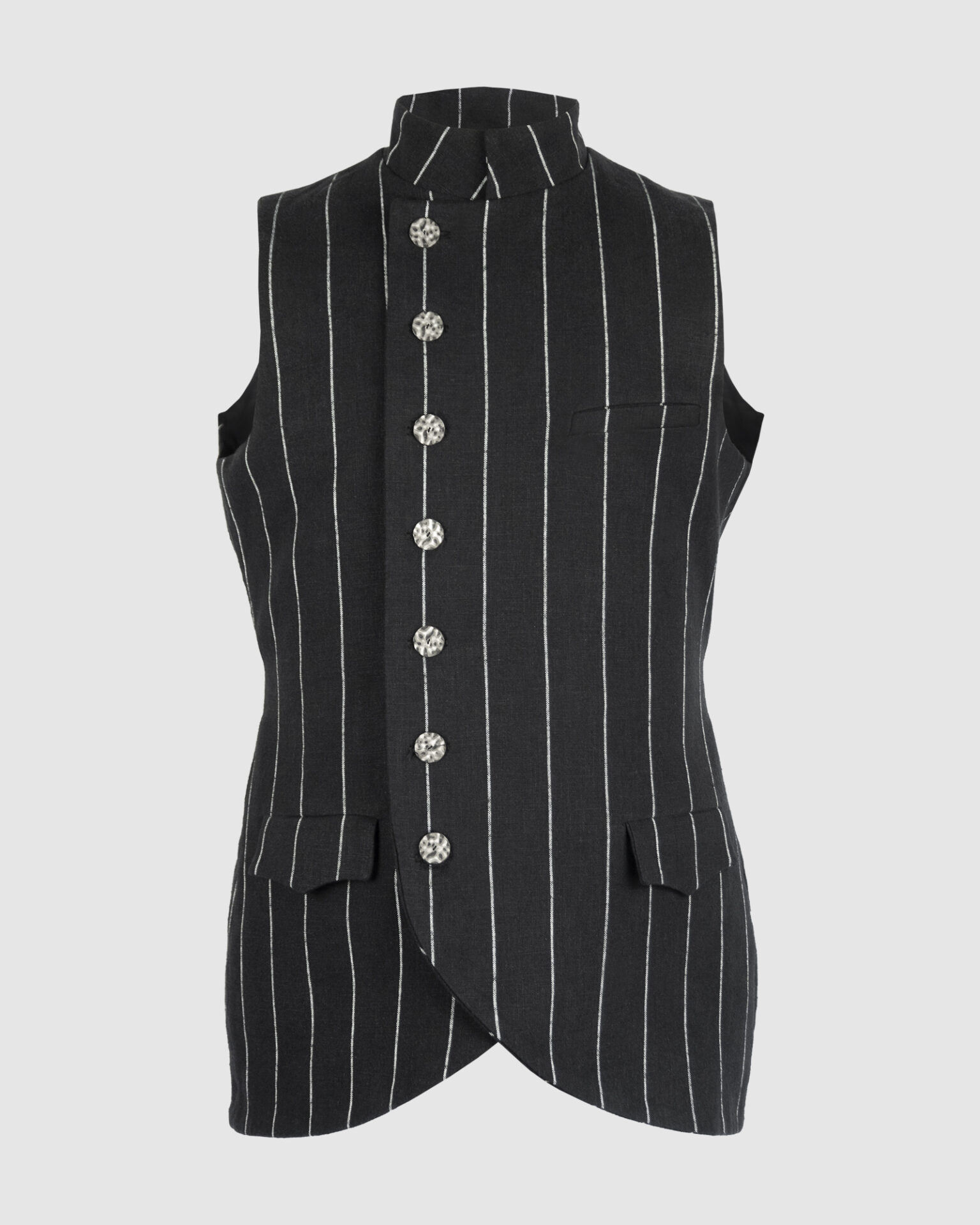 The long, fitted vest features a stand collar, a welt breast pocket, and pockets with pointed flaps.