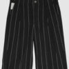 Regular rise, wide leg trousers. The front features a hidden metal button fastening, overlapping architectural pleats, and slash pockets.