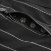 Regular rise, wide leg trousers. The front features a hidden metal button fastening, overlapping architectural pleats, and slash pockets.