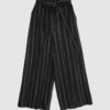 The piece is inspired by traditional Japanese hakama trousers. It is a pair of wide-legged trousers with a high waistband.