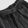 The piece is inspired by traditional Japanese hakama trousers. It is a pair of wide-legged trousers with a high waistband.