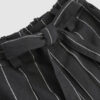The piece is inspired by traditional Japanese hakama trousers. It is a pair of wide-legged trousers with a high waistband.