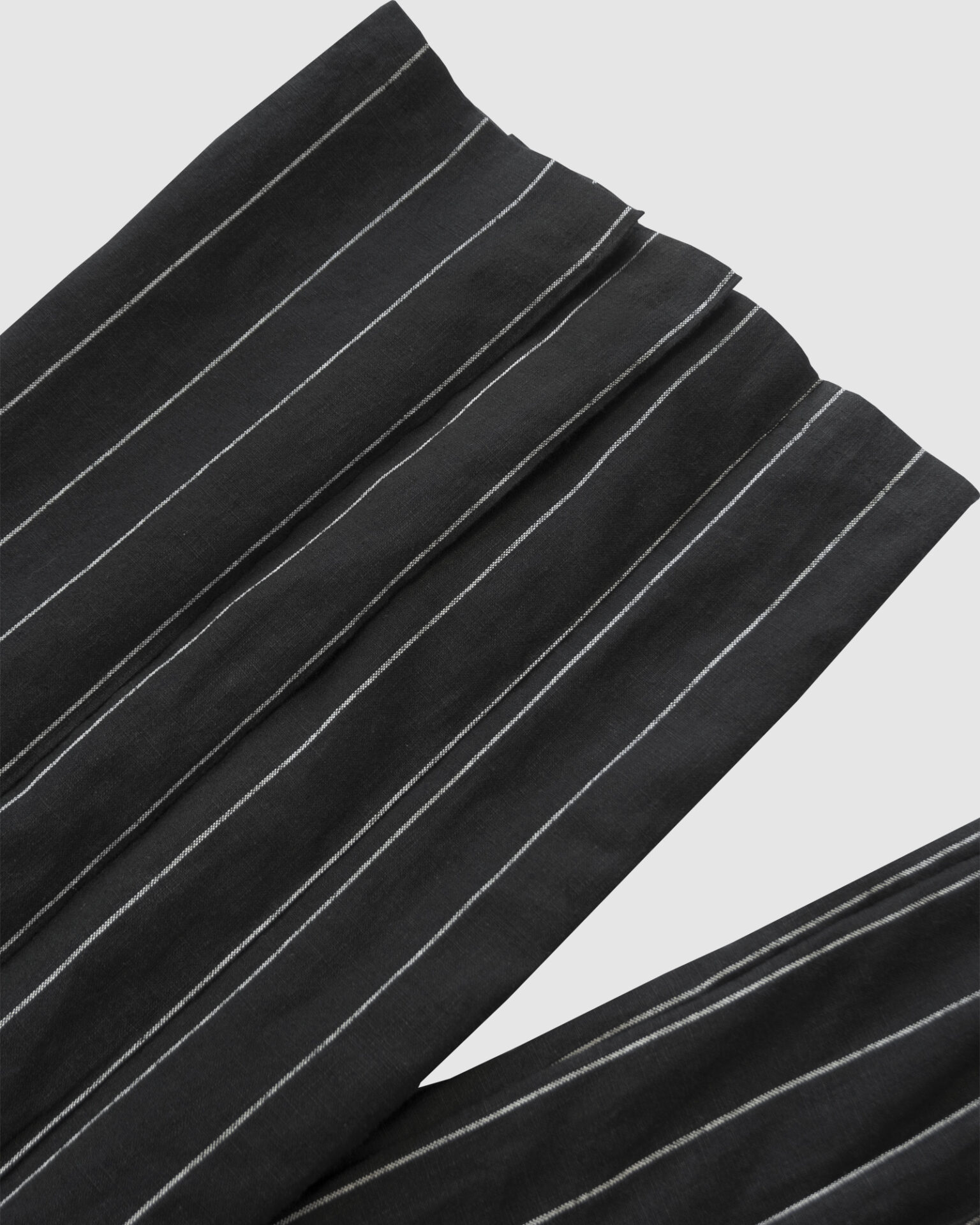 The piece is inspired by traditional Japanese hakama trousers. It is a pair of wide-legged trousers with a high waistband.