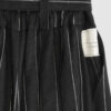 The piece is inspired by traditional Japanese hakama trousers. It is a pair of wide-legged trousers with a high waistband.