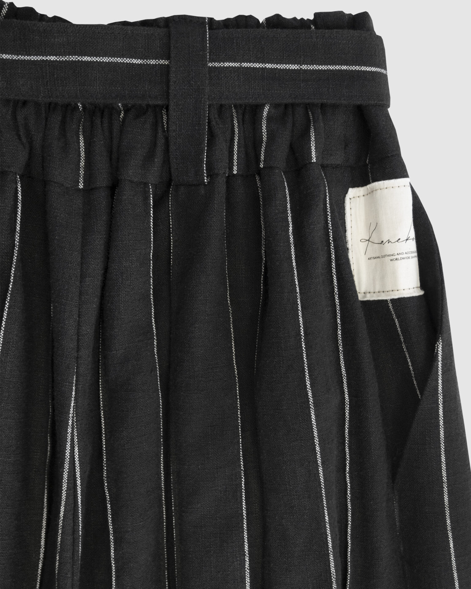 The piece is inspired by traditional Japanese hakama trousers. It is a pair of wide-legged trousers with a high waistband.
