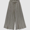 The piece is inspired by traditional Japanese hakama trousers. It is a pair of wide-legged trousers with a high waistband.