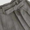 The piece is inspired by traditional Japanese hakama trousers. It is a pair of wide-legged trousers with a high waistband.