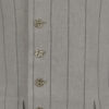The long, fitted vest features a stand collar, a welt breast pocket, and pockets with pointed flaps.
