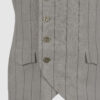 The long, fitted vest features a stand collar, a welt breast pocket, and pockets with pointed flaps.