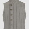 The long, fitted vest features a stand collar, a welt breast pocket, and pockets with pointed flaps.