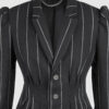 Fitted, single-breasted cotton velvet jacket with narrow peak lapels, released tucks at the waist, side seam pockets, and a softly pointed front hem.