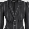 Fitted, single-breasted cotton velvet jacket with narrow peak lapels, released tucks at the waist, side seam pockets, and a softly pointed front hem.