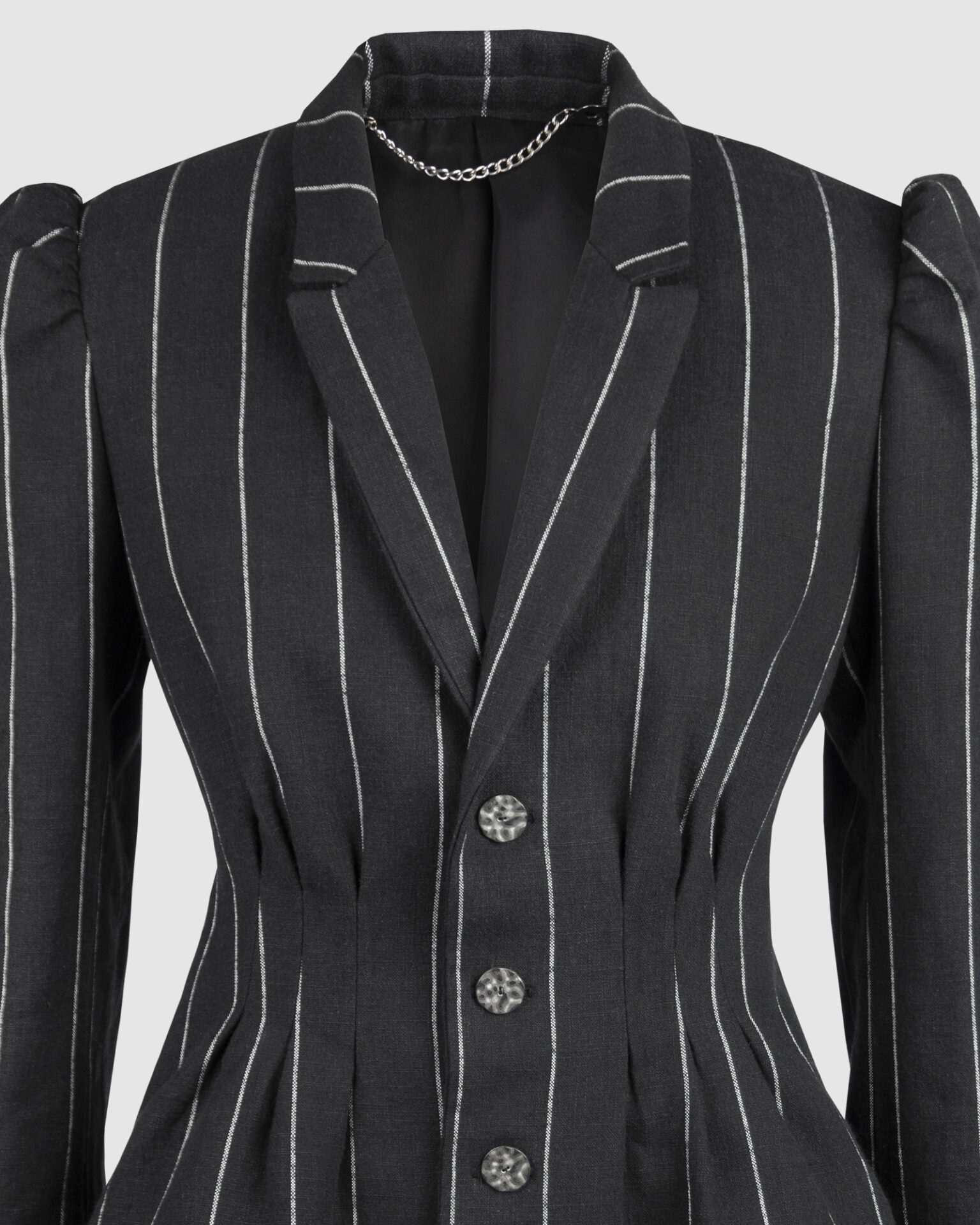 Fitted, single-breasted cotton velvet jacket with narrow peak lapels, released tucks at the waist, side seam pockets, and a softly pointed front hem.