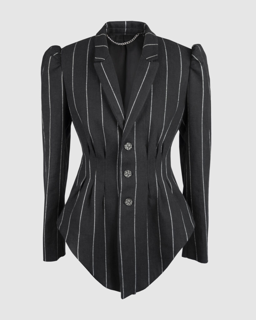 Fitted, single-breasted cotton velvet jacket with narrow peak lapels, released tucks at the waist, side seam pockets, and a softly pointed front hem.