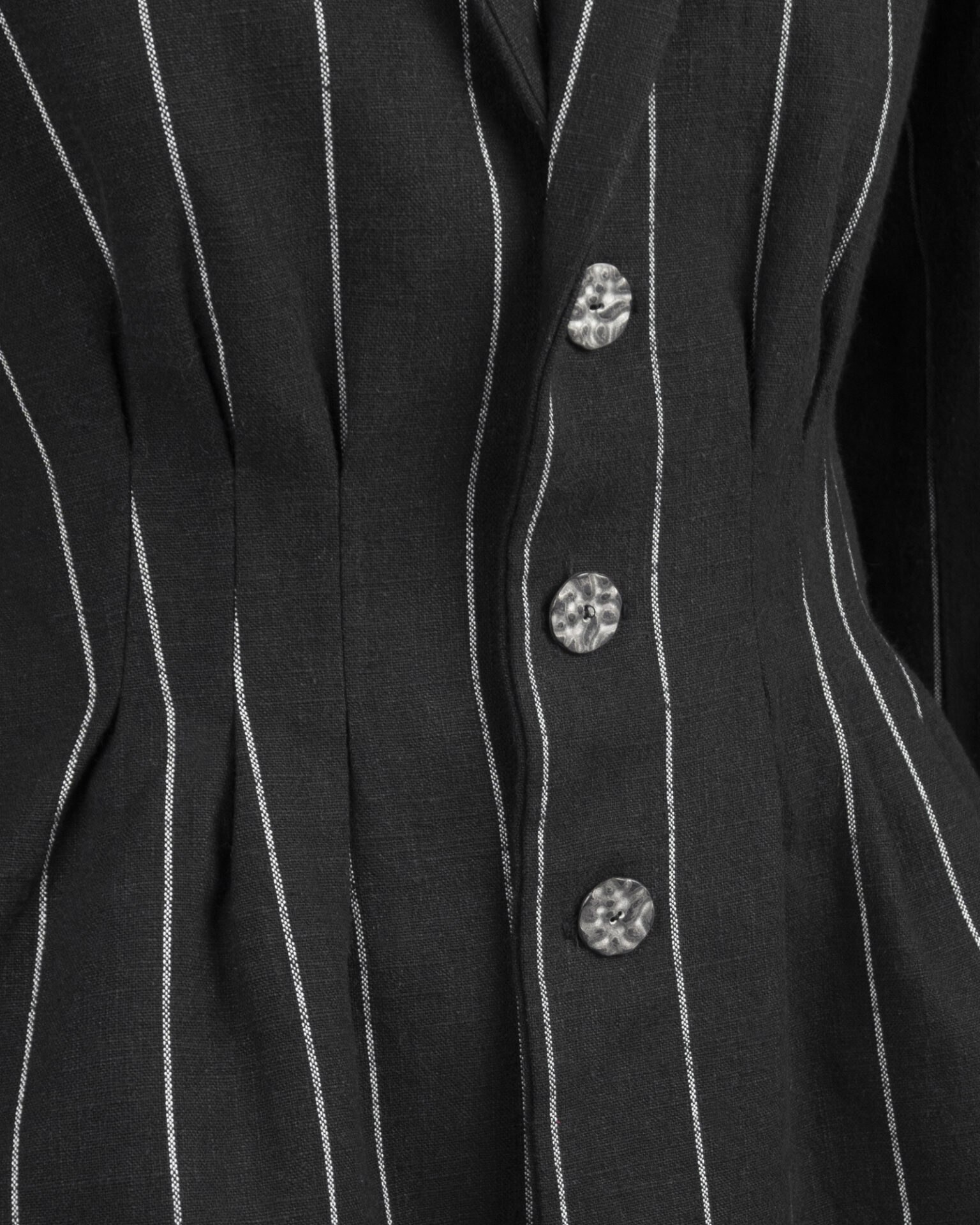 Fitted, single-breasted cotton velvet jacket with narrow peak lapels, released tucks at the waist, side seam pockets, and a softly pointed front hem.