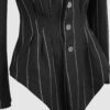 Fitted, single-breasted cotton velvet jacket with narrow peak lapels, released tucks at the waist, side seam pockets, and a softly pointed front hem.