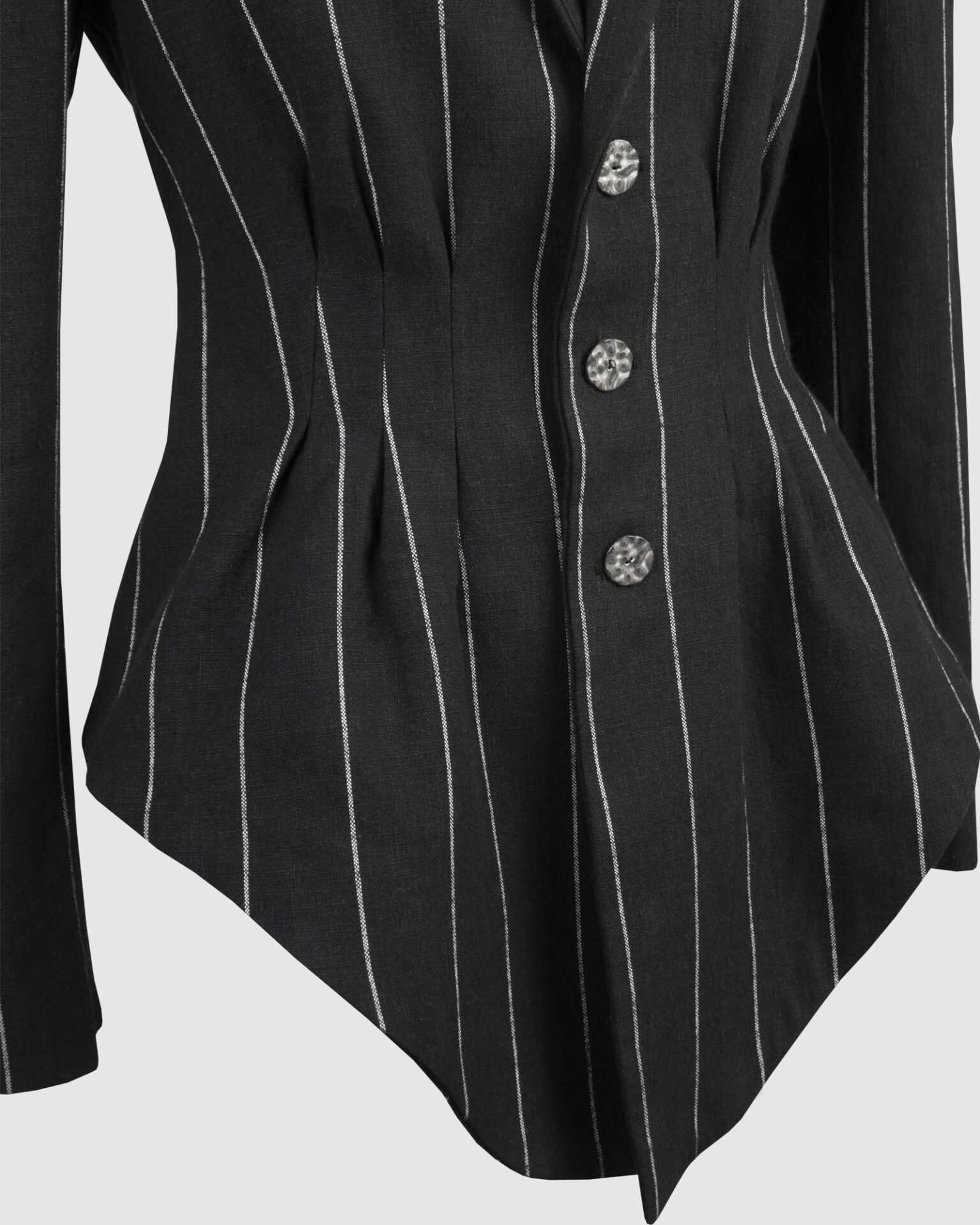 Fitted, single-breasted cotton velvet jacket with narrow peak lapels, released tucks at the waist, side seam pockets, and a softly pointed front hem.
