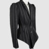 Fitted, single-breasted cotton velvet jacket with narrow peak lapels, released tucks at the waist, side seam pockets, and a softly pointed front hem.