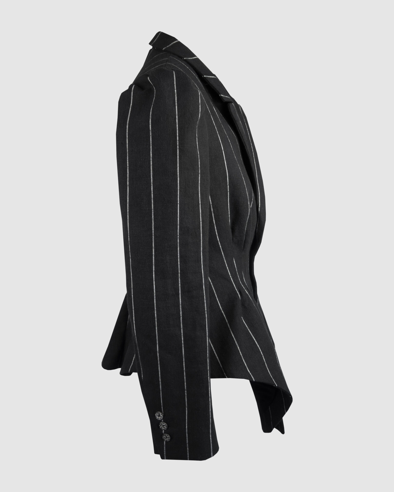 Fitted, single-breasted cotton velvet jacket with narrow peak lapels, released tucks at the waist, side seam pockets, and a softly pointed front hem.
