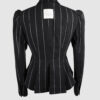 Fitted, single-breasted cotton velvet jacket with narrow peak lapels, released tucks at the waist, side seam pockets, and a softly pointed front hem.