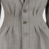 Fitted, single-breasted cotton velvet jacket with narrow peak lapels, released tucks at the waist, side seam pockets, and a softly pointed front hem.