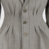 Fitted, single-breasted cotton velvet jacket with narrow peak lapels, released tucks at the waist, side seam pockets, and a softly pointed front hem.