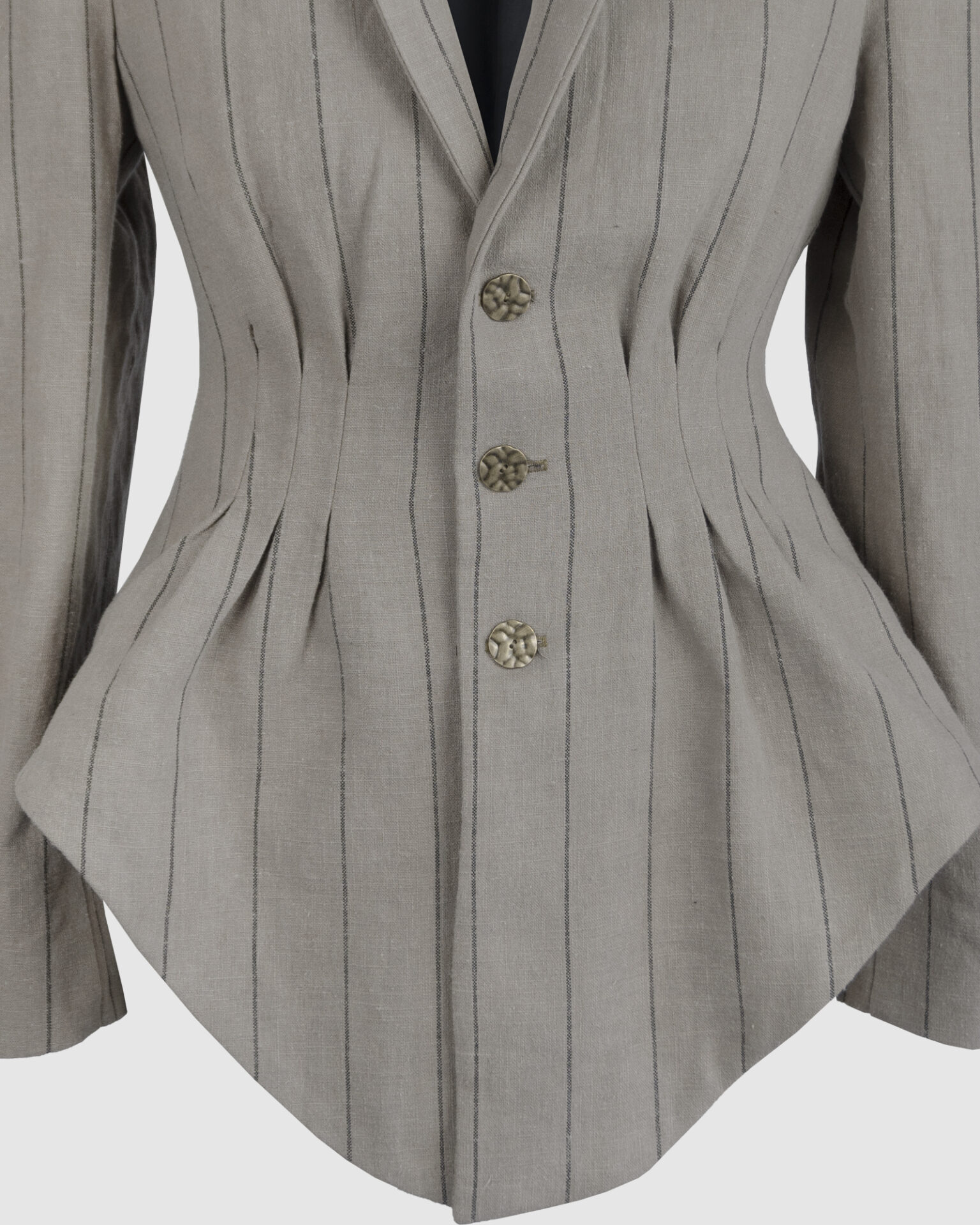 Fitted, single-breasted cotton velvet jacket with narrow peak lapels, released tucks at the waist, side seam pockets, and a softly pointed front hem.
