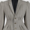 Fitted, single-breasted cotton velvet jacket with narrow peak lapels, released tucks at the waist, side seam pockets, and a softly pointed front hem.